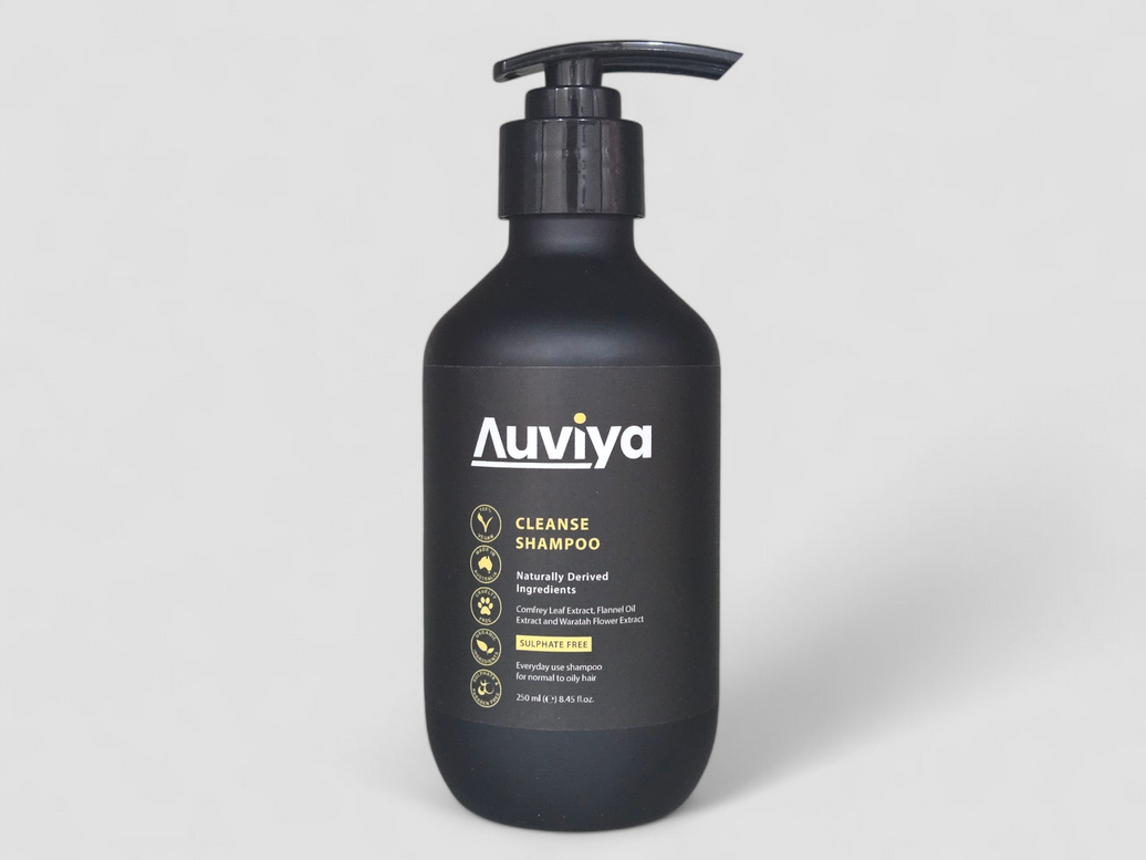 Black shampoo bottle with 'Auviya' branding on a light gray background