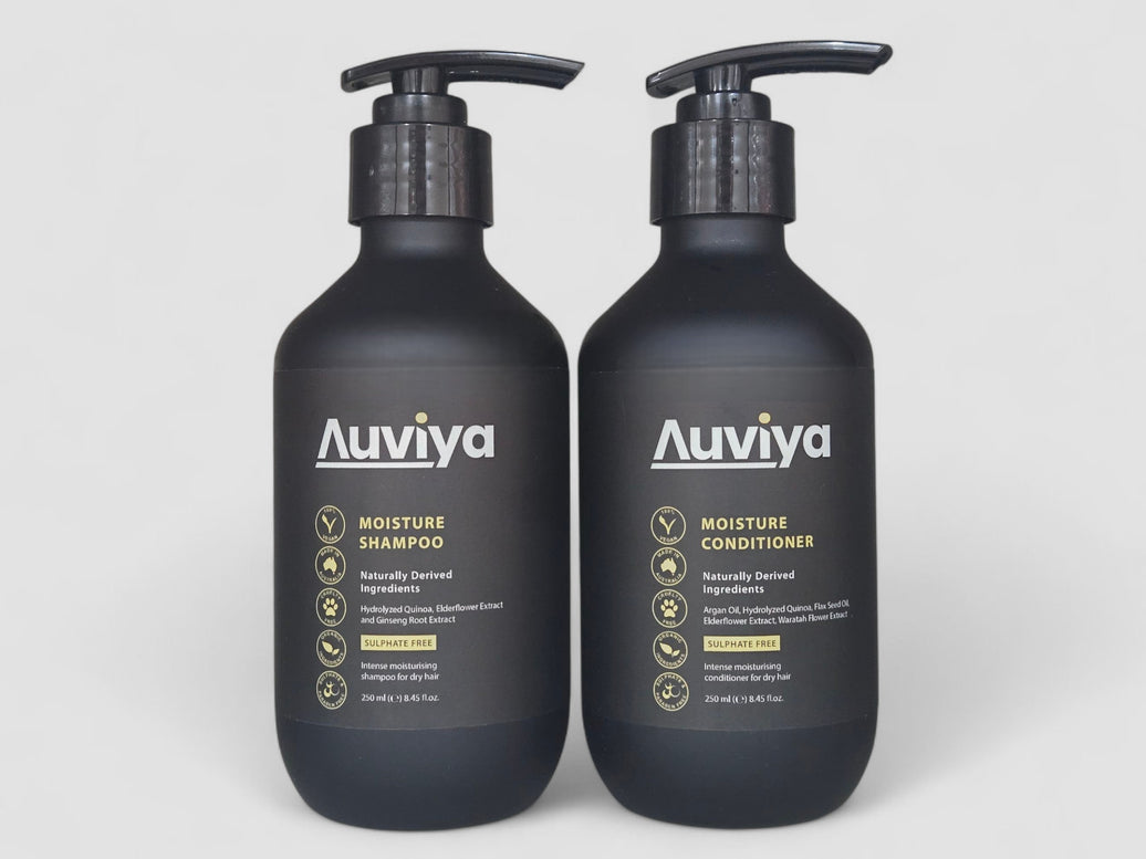 Two Auviya shampoo and conditioner bottles on a white background