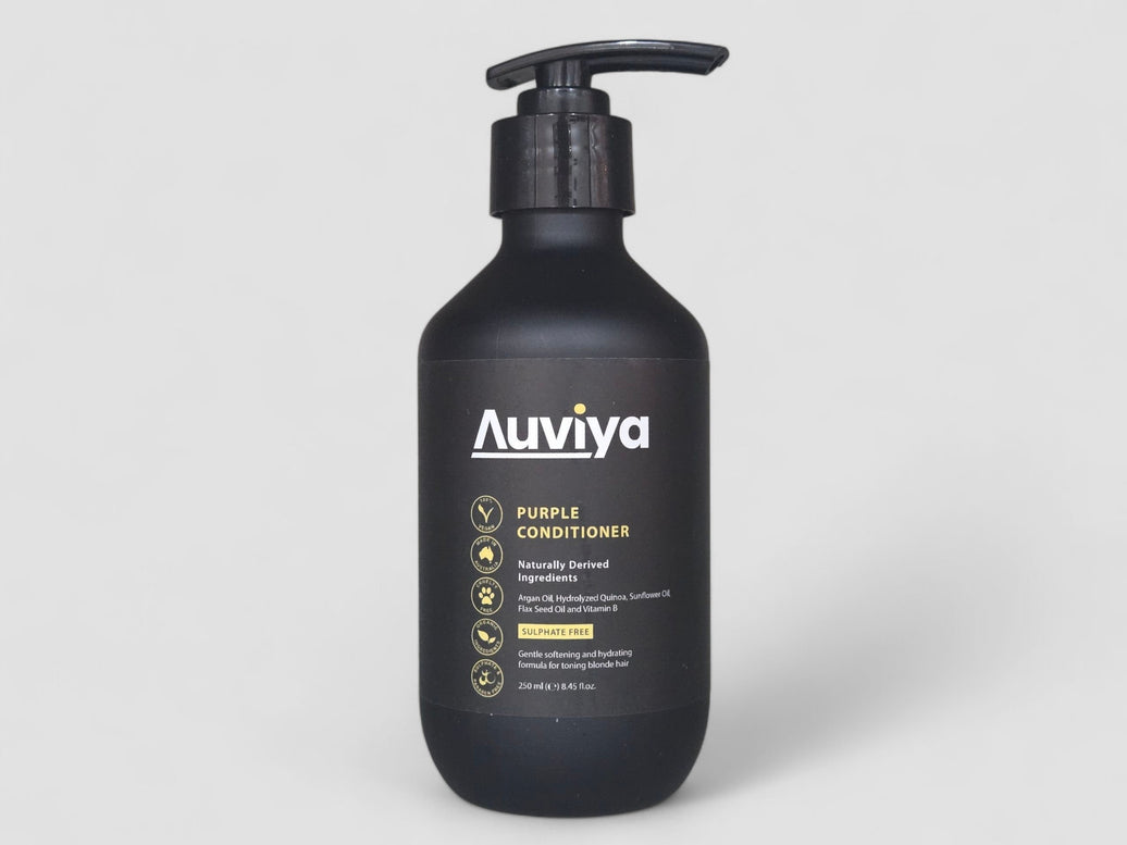 Black bottle of Auviya Purple Conditioner on a light gray background