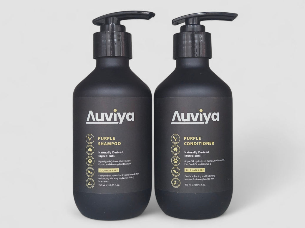Two black bottles of Auviya Purple Shampoo and Conditioner on a white background