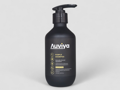 Black shampoo bottle with 'Auviya' branding on a light gray background