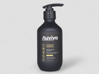 Black shampoo bottle with 'Auviya' label on a light gray background